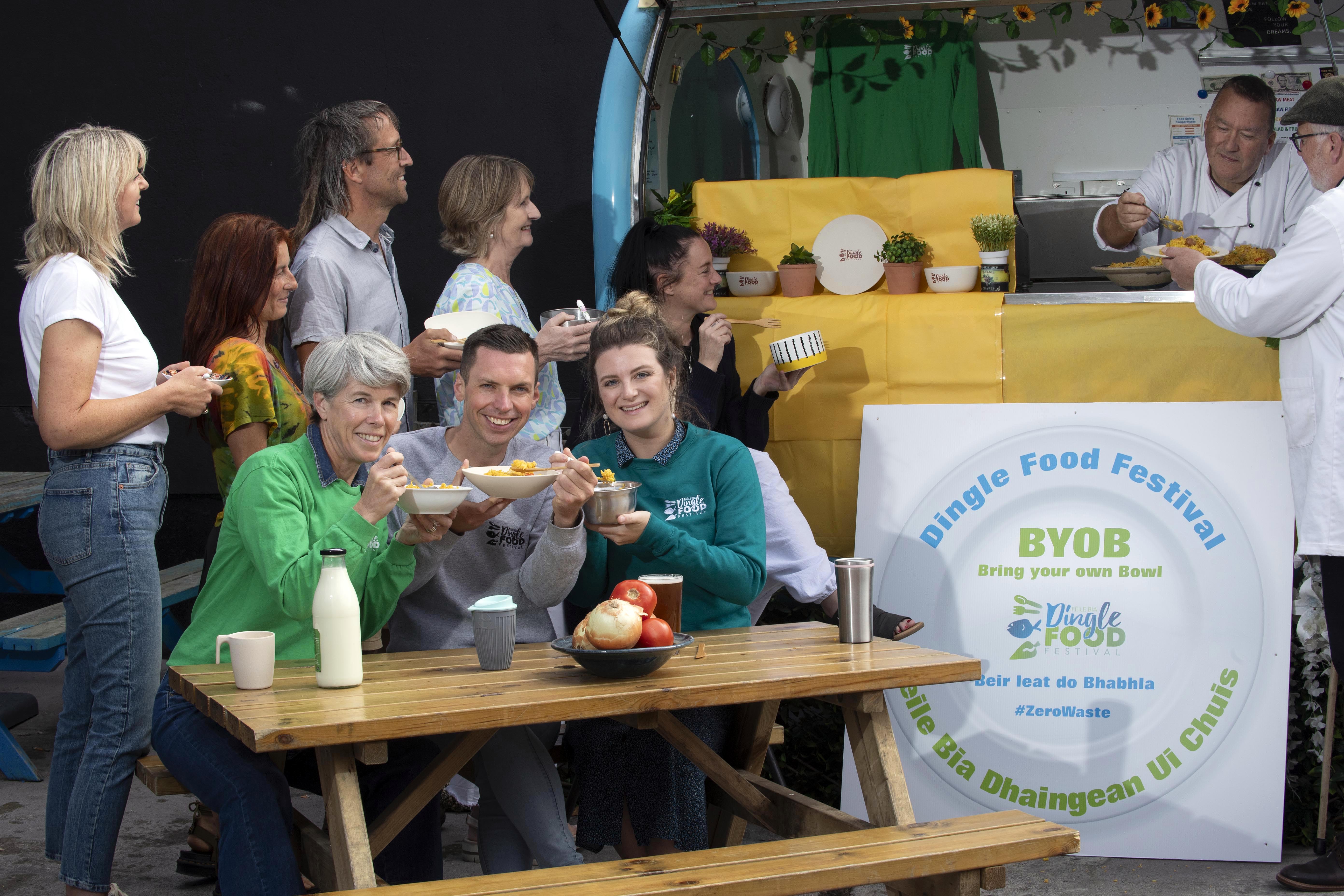 Bring your own bowl, rent a bowl or buy a bamboo bowl are the new changes to the 2024 Dingle Food Festival which is continuing its mission to be the first Irish “Zero Landfill Waste” festival and will take place from Friday 4th to Sunday the 6th of October in the West Kerry town.  Included are in photo are in front, Gráinne Kelliher, (with her own bowl), Jamie Ó Flannura, (with a purchased bamboo bowl) and Aisling Conlon (with the €2 rental bowl) while at back are sustainable members Manuela DEi Grande, Niamh O'Kennedy, Darach Ó Murchú, Martin Bealin, Eileen Ashe and Trevis Gleason promoting the new sustainable changes at this years festival launch in Dingle this week. Taste trail and market outlets will only be serving food on to reusable tableware, with the main aim being to reduce the amount of disposable packaging over the weekend.
Photo: Don MacMonagle
PRESS RELEASE:
Dingle Food Festival, fantastic tastes, zero waste!
Once again this year, all festival goers are being encouraged to bring their own bowl - bear leat do babhla! For those who don’t, there will be stainless steel bowls available to rent for two euro (with five euro deposit). There will also be festival packs on sale consisting of a bamboo bowl and cutlery set. Taste trail and market outlets will only be serving food onto reusable tableware, with the main aim being to reduce the amount of disposable packaging over the weekend. Speaking at today’s launch, festival Chairperson Martin Bealin was highlighting the amount of waste festivals generate and the sustainable practices that the Dingle Food Festival are implementing to reduce this. “There will be approximately 150,000 tastings happening over the weekend, so getting rid of the disposable packaging will make a huge impact… it’s a big challenge for the Dingle Food Festival community but one we know will be embraced” he said.Other sustainable practices over the weekend will be  HVO Generators - festival generators will be run on ethically sourced HVO for the weekend, providing the electricity for the market stalls. Less Paper - printed material moving online, with a smaller festival programme being printed. 
Green Transport - working with Bus Éireann and The Local Link, providing more bus options to and from the peninsula over the weekend Sustainable practices workshops - workshops on how you can practice better sustainability including one specifically for children, delivered by Jennider Attard of MTU on “Limiting Food Waste” Micro Bio Digester manufacturer “MyGug” will set up  a micro bio digester to convert all the unavoidable food waste, instantly into gas, which will be used to power the cookery demonstrations by local producers. Highlights of this year’s festival include the much loved Taste Trail, where festival goers purchase a book of taste tickets and get to sample food delights throughout the picturesque town. Numerous Food Masterclasses and workshops will be taking place including Pitmaster Barbeqing from Smokin Soul, Seafood Curing and Smoking with Burren Smokehouse, Sourdough Making, Cake Baking and Wine Tasting and much much more. Tickets for all masterclass and workshops can be purchased from dinglefood.com where full the line up and event details are also listed. Together with the Blas na hEireann Irish Food Awards, market stalls, street entertainment, live music and kids activities, there really is something for everyone! Check out www.dinglefood.com
PHOTO ISSUED BY DINGLE FOOD FESTIVAL